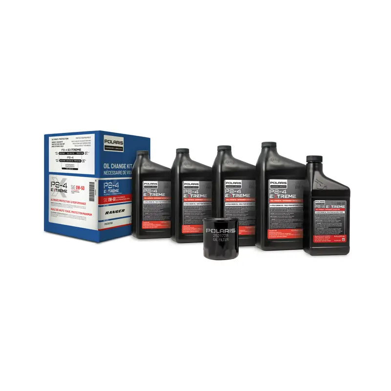A set of black motor oil containers and an oil filter, labeled with the Polaris brand and specifications, indicating a full synthetic oil change kit.