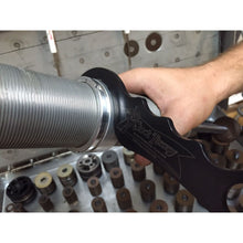 Cross over ring tightener